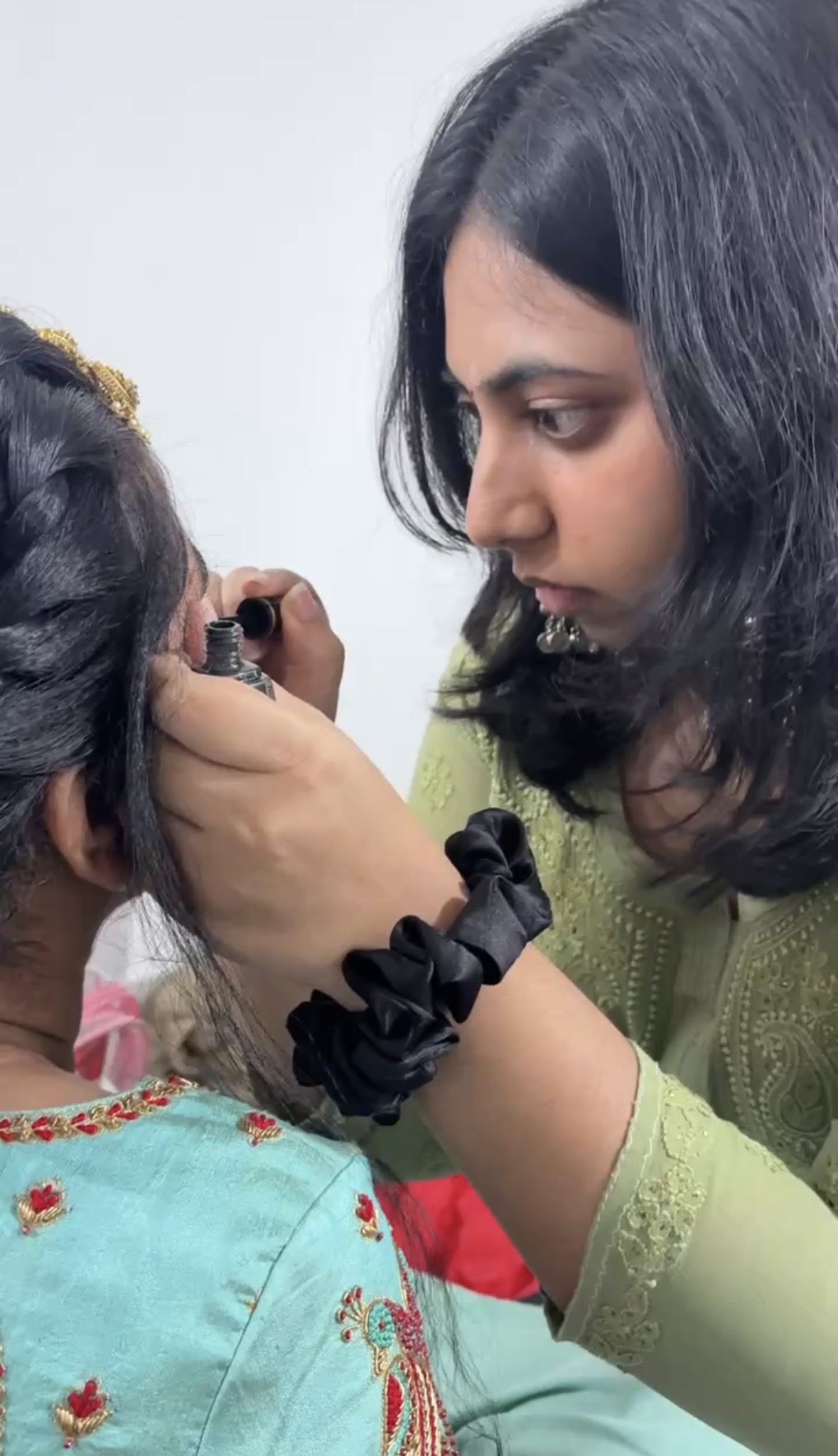 Sriya applying makeup